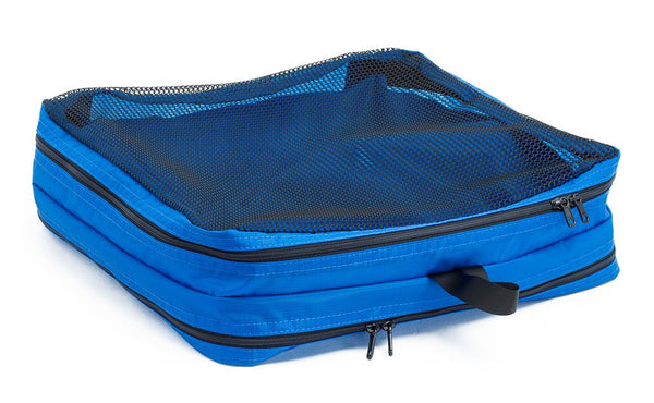 An empty and zipped closed Island (blue) Aether Large Laundry Aeronaut 45 Packing Cube mesh side up.